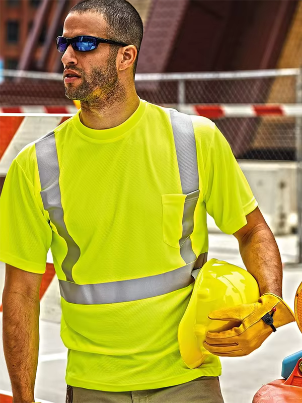 Construction worker wearing a yellow reflective safety shirt